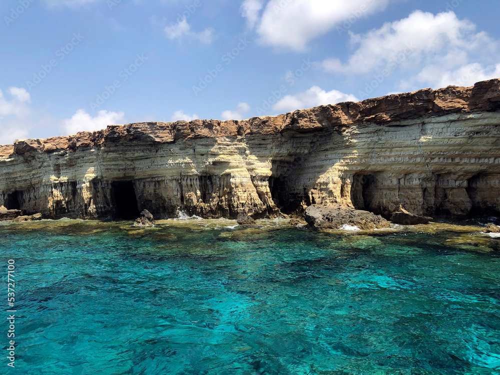 White cliffs. Sea caves near Paphos. Beautiful Cyprus landscape. Cyprus coast view from water. Very calming and relaxing seascape. Turquoise sea and white rocks