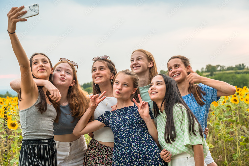 Teenage girls take a selfie in summer. Copy space. Teenage girls take a selfie in summer. Copy space.