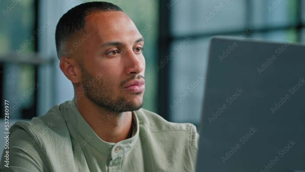 Portrait thoughtful pensive 30s male think businessman manager financial analyst working online with app browsing in computer at modern office desk pondering idea searching problem solution thinking