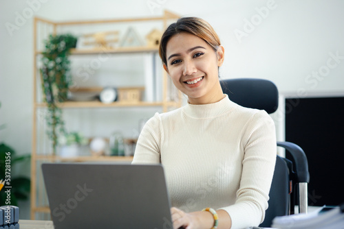 Asian women working in the office, young Asian business women as business executives, founding and running start-up executives, young female business leaders. Startup business concept.