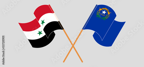 Crossed and waving flags of Syria and The State of Nevada