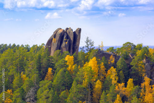 Colorful autumn mountain landscape with Perjya pillars in Stolby Nature Reserve in Krasnoyarsk, Russia photo