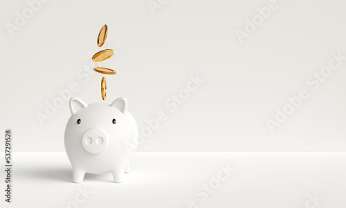 Gold coins falling and dropping to white piggy bank on white background. Concept of savings for investment, financial management, savings for future retirement. with copy space. 3D rendering 