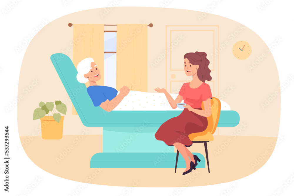 Fototapeta premium Young woman sitting beside elderly lady lying in hospital bed. Female character holding cup of tea and talking to grandmother in medical ward flat vector illustration. concept for banner, landing page