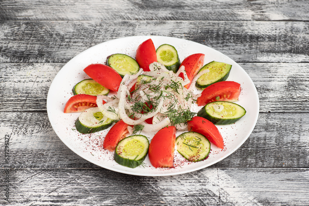 Salad, salad with vegetables on a wooden white background Salad, salad with vegetables on a wooden white background