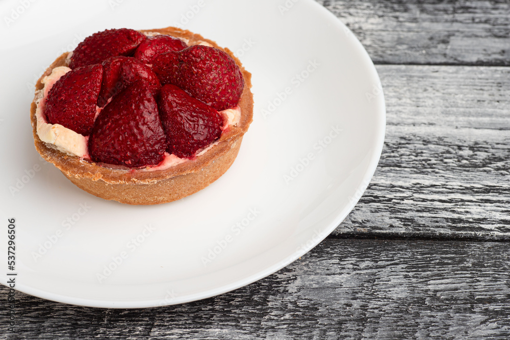 Dessert, berry dessert on a wooden white background Dessert, berry dessert on a wooden white background