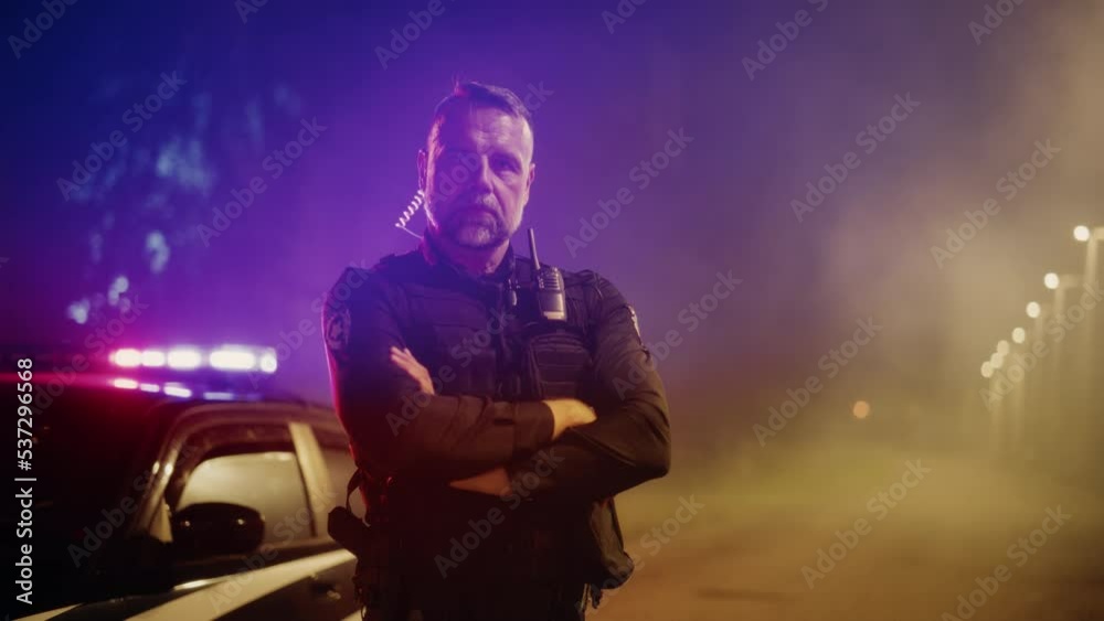 Portrait of Professional Caucasian Male Police Officer Crossing His Arms, Posing, Looking at the Camera. Heroic Officer of the Law on Duty, Keeping Citizens and Civilians Safe, Fighting Crime Portrait of Professional Caucasian Male Police Officer Crossing His Arms, Posing, Looking at the Camera. Heroic Officer of the Law on Duty, Keeping Citizens and Civilians Safe, Fighting Crime