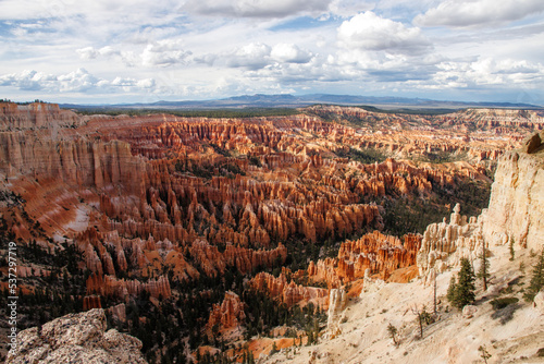 Bryce Canyon - red spiky rocks in Bryce canyon in Utah. Bryce canyon amphitheater overlook with fascinating red and orange rocks in the golden hour