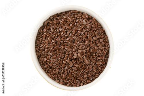 Chocolate sprinkles in white bowl top view