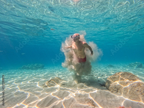 underwater man snorkeling in the sea withcrystal-clear waters of a beach concept of holiday relax summer beach diver in the sea 