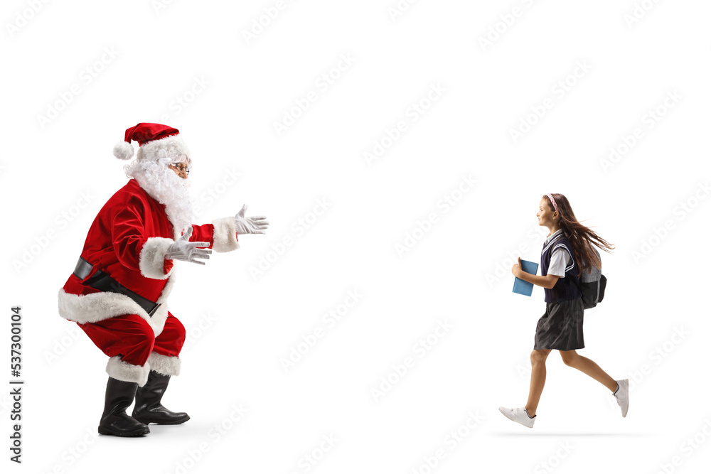 Schoolgirl running to hug santa claus Schoolgirl running to hug santa claus