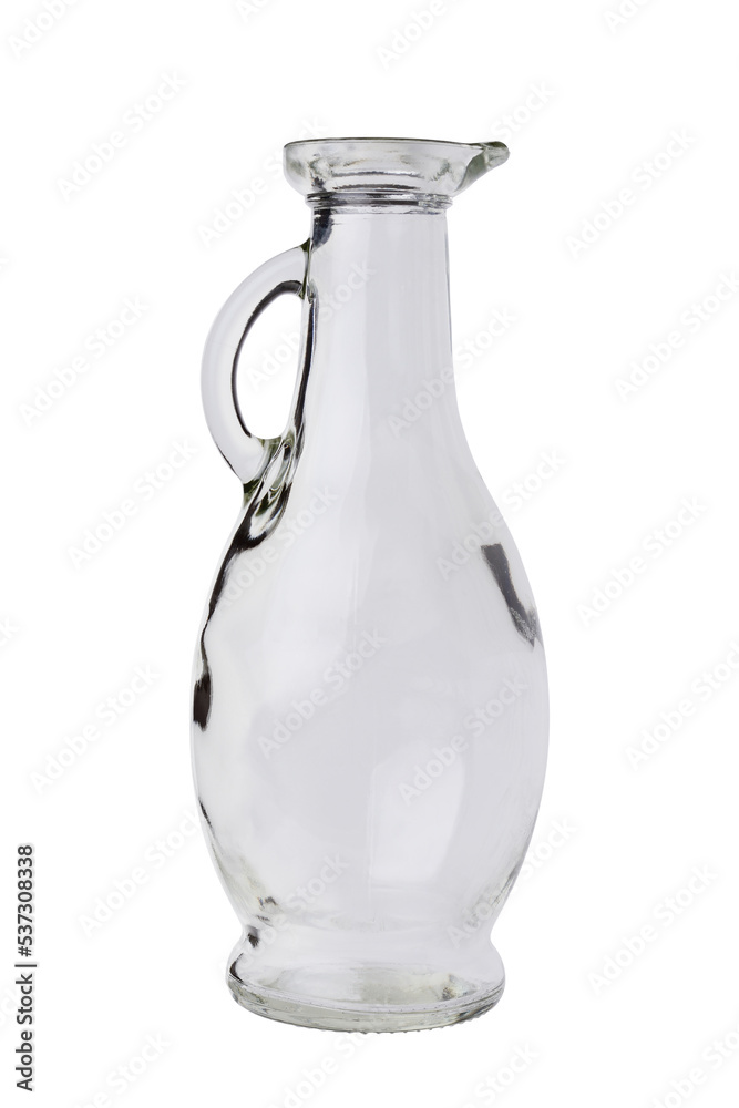 An empty glass, transparent jug with a handle and a narrow neck. Isolated on a white background.