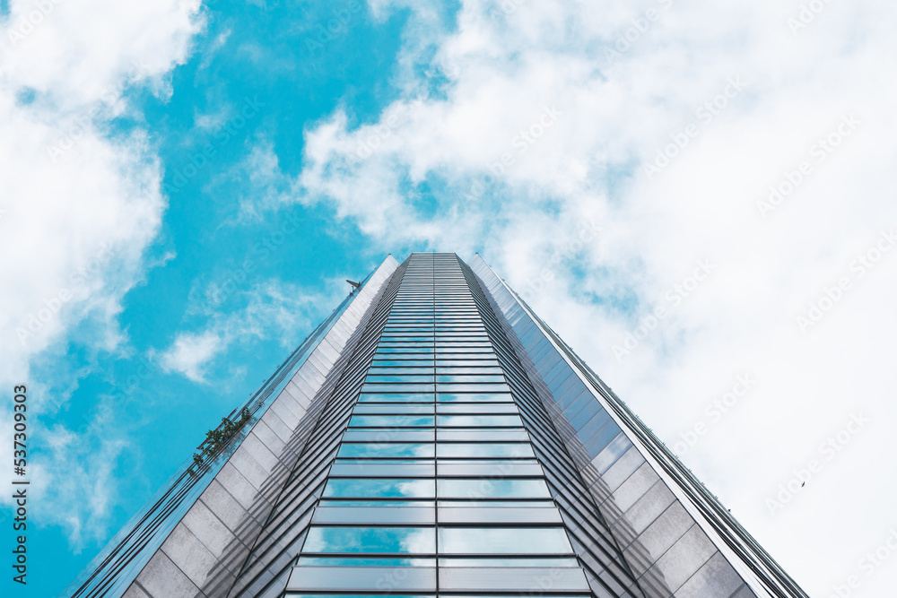 Fototapeta premium underside panoramic and perspective view to steel blue glass high rise building skyscrapers