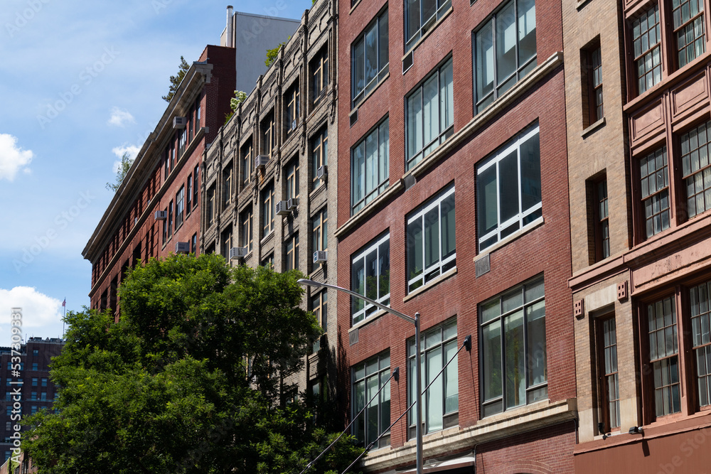 Row of Old Brick Buildings along a Street in Chelsea of New York City
