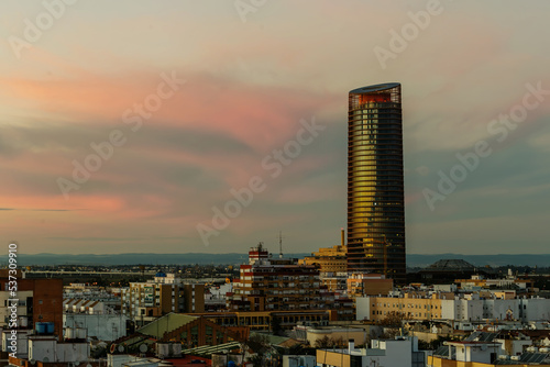 Pelli Tower at sunset. View from the traditional neighborhood of Triana in Seville, Spain. photo