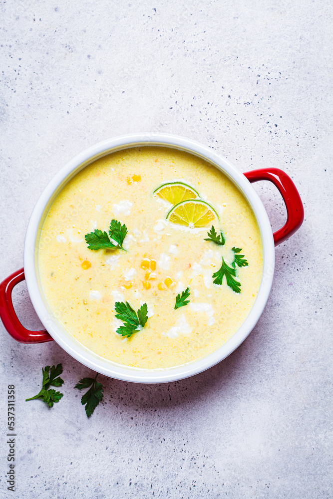 Corn soup in red pot. Vegan recipe concept. Corn soup in red pot. Vegan recipe concept.