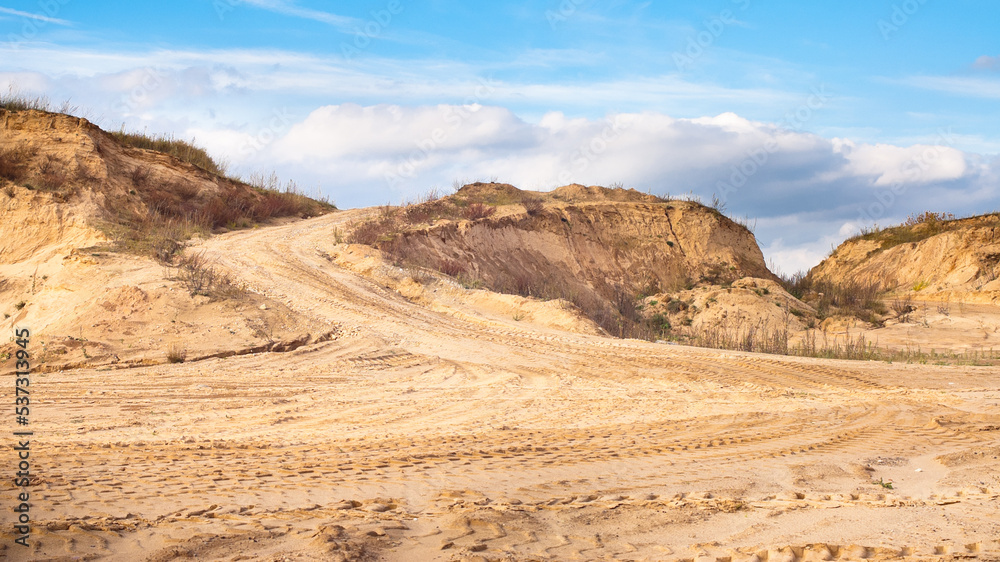 sand quarry, in the photo, a quarry for the extraction of sand against a blue sky sand quarry, in the photo, a quarry for the extraction of sand against a blue sky