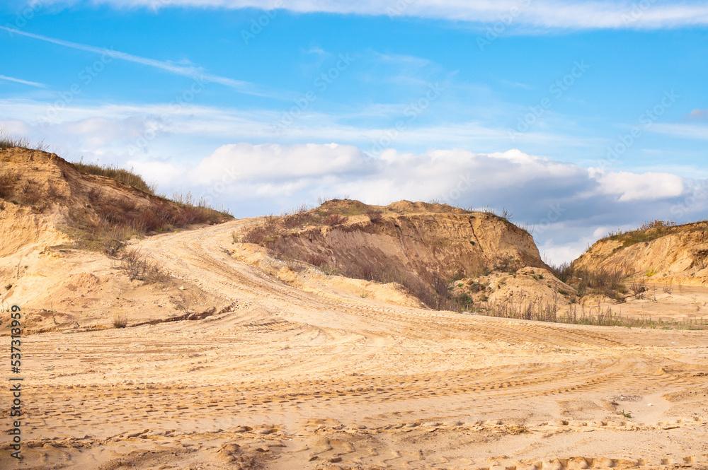 sand quarry, in the photo, a quarry for the extraction of sand against a blue sky