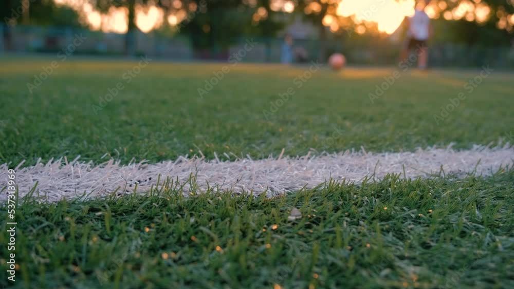Football Training at sunset. Football players play football at sunset. Training before the World Cup. Football Training at sunset. Football players play football at sunset. Training before the World Cup.