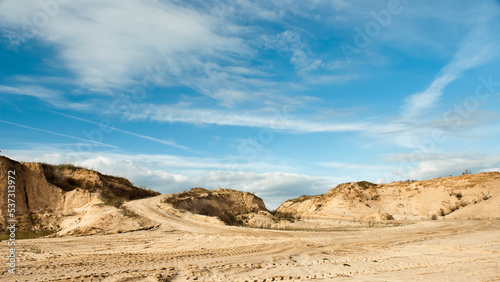 sand quarry, in the photo, a quarry for the extraction of sand against a blue sky