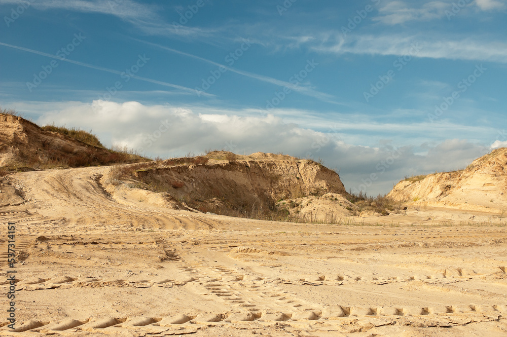 sand quarry, in the photo, a quarry for the extraction of sand against a blue sky sand quarry, in the photo, a quarry for the extraction of sand against a blue sky