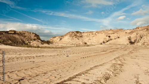 sand quarry  in the photo  a quarry for the extraction of sand against a blue sky