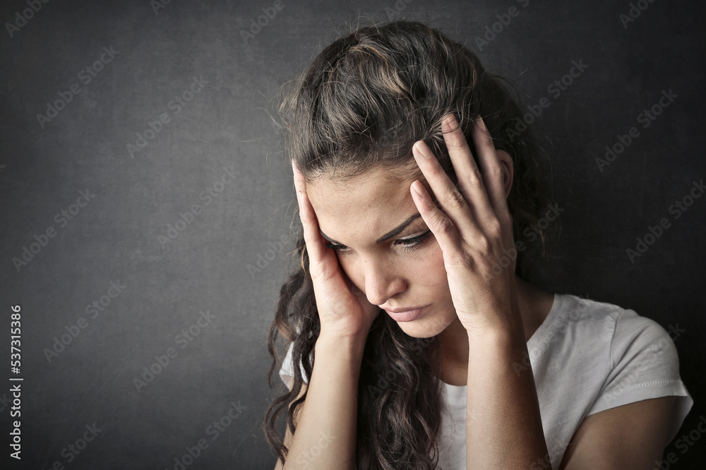 portrait of young woman with headache portrait of young woman with headache