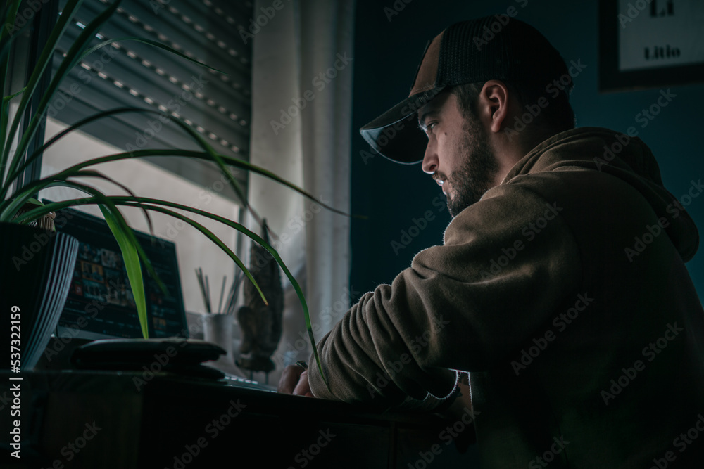 Young stressed man in front of a computer. Young stressed man in front of a computer.
