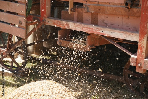 Closeup of a winnowing machine, the process of chaff being separated from grain. photo