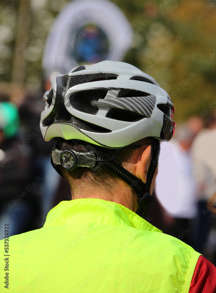 cyclist with protective helmet at the start of a cycling race
