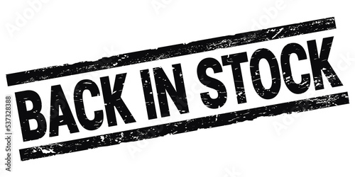 BACK IN STOCK text on black rectangle stamp sign.