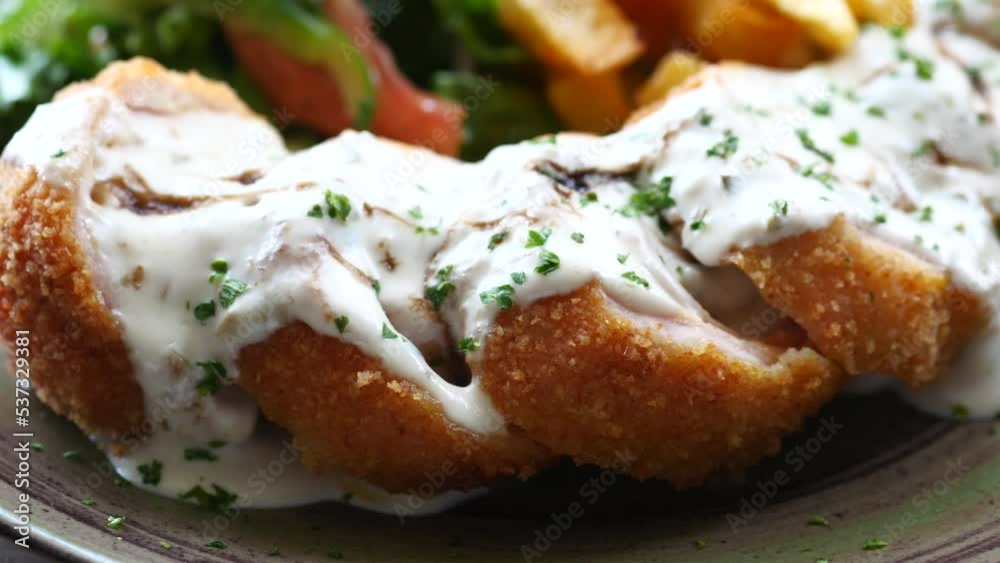 Chicken Cordon Bleu and Mayonnaise on table Chicken Cordon Bleu and Mayonnaise on table