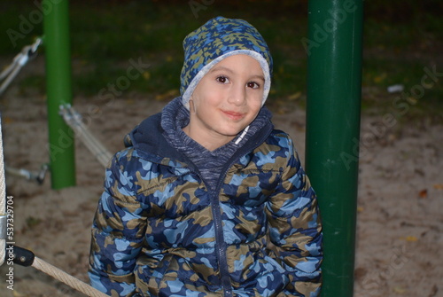 child on a playground in the evening 