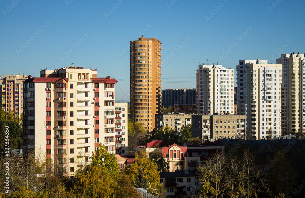Facades of modern multi-storey buildings against a bright blue sky and a space for copying in the city Reutov, Moscow region, Russia Facades of modern multi-storey buildings against a bright blue sky and a space for copying in the city Reutov, Moscow region, Russia