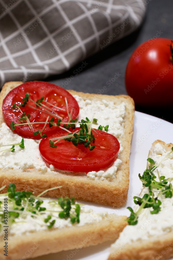 Vegan sandwich with chis cheese, tomatoes and microgreens. Vegan Food.