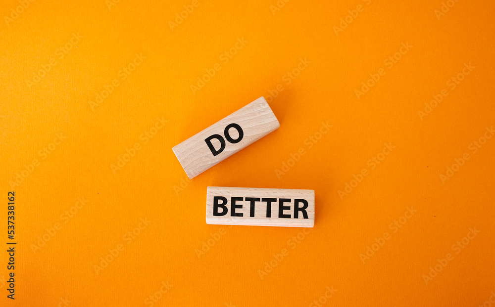 Do better symbol. Wooden blocks with words Do better. Beautiful orange background. Business and Do better concept. Copy space. Do better symbol. Wooden blocks with words Do better. Beautiful orange background. Business and Do better concept. Copy space.