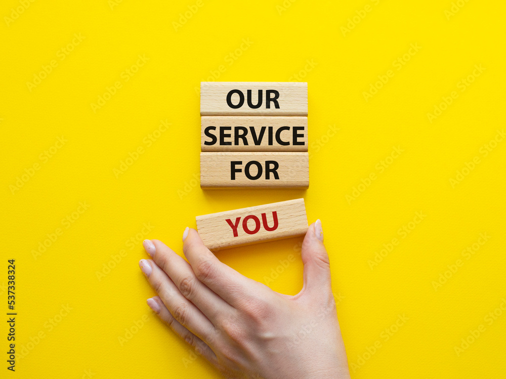 Our service for you symbol. Wooden blocks with words Our service for you. Beautiful yellow background. Businessman hand. Business and Our service for you concept. Copy space. Our service for you symbol. Wooden blocks with words Our service for you. Beautiful yellow background. Businessman hand. Business and Our service for you concept. Copy space.