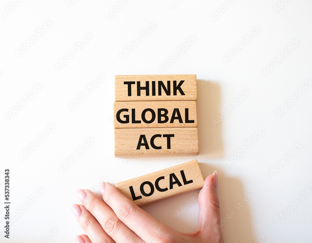 Think global act local symbol. Wooden blocks with words Think global act local. Beautiful white background. Businessman hand. Business and Think global act local concept. Copy space. Think global act local symbol. Wooden blocks with words Think global act local. Beautiful white background. Businessman hand. Business and Think global act local concept. Copy space.