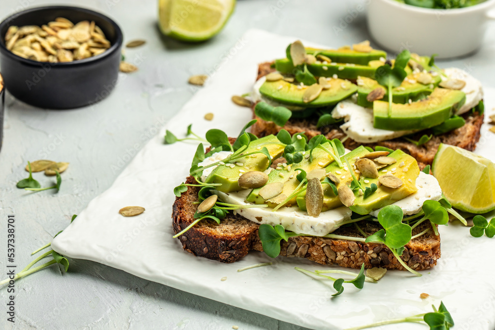 avocado toasts with rye bread, Delicious breakfast or snack, Clean eating, dieting, vegan food concept. top view avocado toasts with rye bread, Delicious breakfast or snack, Clean eating, dieting, vegan food concept. top view