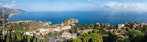 Aerial wide angle view of Taormina and its beautiful coastline