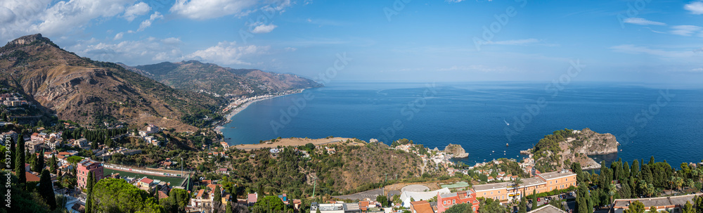 Aerial wide angle view of Taormina and its beautiful coastline