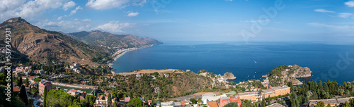 Fototapeta Naklejka Na Ścianę i Meble -  Aerial wide angle view of Taormina and its beautiful coastline