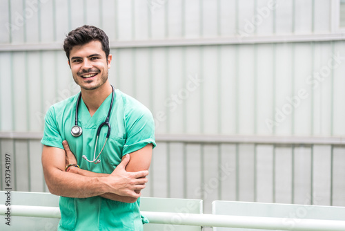 Doctor with crossed arms posing