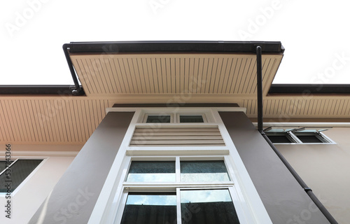 Exterior of modern house with window, roof and ceiling and rain gutter. © Direk Takmatcha