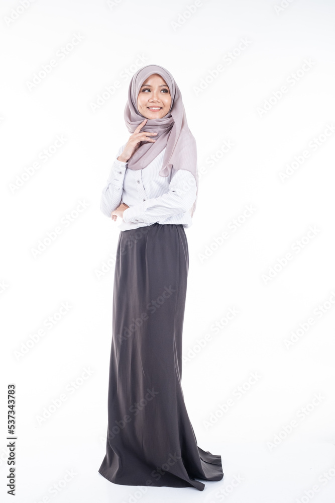 Portrait of Muslim woman in office attire and wearing a hijab. Asian woman in a corporate world. Formal corporate outfit and elegant appearance. Corporate or business people concept. Isolated Portrait of Muslim woman in office attire and wearing a hijab. Asian woman in a corporate world. Formal corporate outfit and elegant appearance. Corporate or business people concept. Isolated