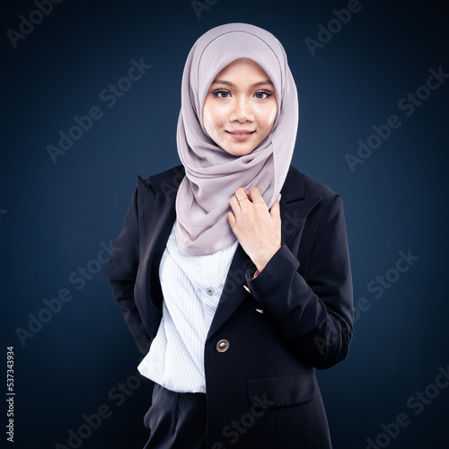Close up portrait of Muslim woman in office attire and wearing a hijab. Asian woman in a corporate world. Formal corporate outfit and elegant appearance. Corporate or business people concept. Isolated