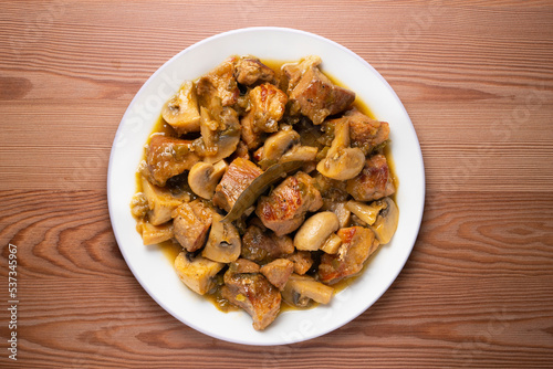 Braised pork with red wine sauce and mushrooms. Traditional northern Spanish tapas.