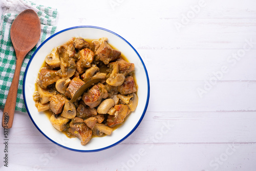 Braised pork with red wine sauce and mushrooms. Traditional northern Spanish tapas.