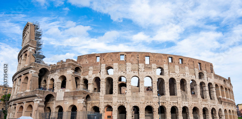 Colosseum against a blue sky with clouds. Italy, October 2022