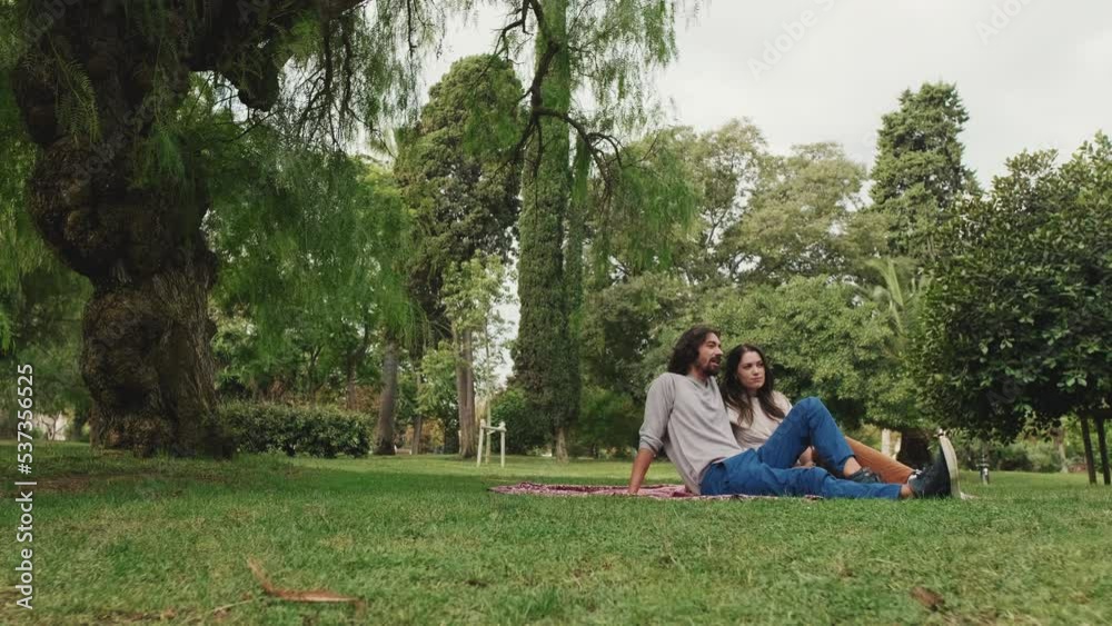Happy man and woman having picnic outdoors Happy man and woman having picnic outdoors